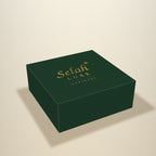 Illustration of a forest green gift box with the gold Selah Luxe Official logo on the lid
