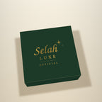 Illustration of the top of a forest green gift box lid with the gold Selah Luxe Official logo