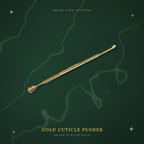 Selah Luxe Official gold cuticle pusher on a cream marble background.